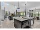 Open concept kitchen with island overlooking living area at 2847 Calvano Dr, Land O Lakes, FL 34639