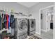 Well-equipped laundry room with washer, dryer, and storage at 2847 Calvano Dr, Land O Lakes, FL 34639