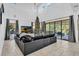 Spacious living room with sectional sofa and sliding glass doors at 2847 Calvano Dr, Land O Lakes, FL 34639