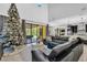 Open living room showcasing a Christmas tree and kitchen view at 2847 Calvano Dr, Land O Lakes, FL 34639
