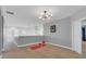 Bright loft area with hardwood floors and a chandelier at 2847 Calvano Dr, Land O Lakes, FL 34639