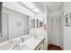 Clean bathroom with double vanity and updated fixtures at 2902 Oak Cir, Tarpon Springs, FL 34689