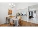 Charming dining room with hardwood floors and a view into the kitchen at 2902 Oak Cir, Tarpon Springs, FL 34689