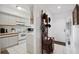 Bright and airy entryway with kitchen and unique hat stand visible at 2902 Oak Cir, Tarpon Springs, FL 34689
