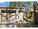 Attached garage with a light tan exterior at 2902 Oak Cir, Tarpon Springs, FL 34689