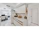 Bright kitchen with white cabinets, offering ample counter space at 2902 Oak Cir, Tarpon Springs, FL 34689