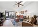 Spacious living room with hardwood floors, ceiling fan, and comfortable seating at 2902 Oak Cir, Tarpon Springs, FL 34689