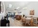 Bright living room features hardwood floors, vaulted ceilings and access to a private patio at 2902 Oak Cir, Tarpon Springs, FL 34689