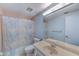 Bathroom with vanity, shower, and floral curtain at 30 Turner St # 201, Clearwater, FL 33756