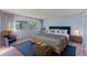 Spacious bedroom with light blue walls and a king-size bed at 30 Turner St # 201, Clearwater, FL 33756