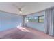 Bright bedroom features a ceiling fan and a large window providing ample natural light at 30 Turner St # 201, Clearwater, FL 33756