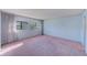 Bright bedroom featuring pink carpet and ample natural light at 30 Turner St # 201, Clearwater, FL 33756