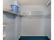 Simple closet with wire shelving and blue carpet at 30 Turner St # 201, Clearwater, FL 33756