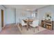 Bright dining room with light walls and wooden table at 30 Turner St # 201, Clearwater, FL 33756