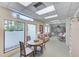 Community game room featuring a table, chairs, sofa and large window at 30 Turner St # 201, Clearwater, FL 33756