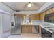 A kitchen with stainless steel appliances, laminate countertops and wood cabinets at 30 Turner St # 201, Clearwater, FL 33756