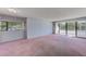 Large living room featuring sliding glass doors to a private balcony at 30 Turner St # 201, Clearwater, FL 33756