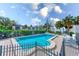 Inviting community pool with lounge chairs and nearby bay views at 30 Turner St # 201, Clearwater, FL 33756