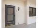 Private front door entrance to condo at 3044 Red Oak Ct # 104, Palm Harbor, FL 34684