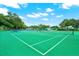 Expansive tennis and pickleball courts with surrounding trees at 3276 38Th S Way # B, St Petersburg, FL 33711