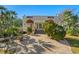 Spanish style home with a brick driveway and lush landscaping at 334 Bay St, Tarpon Springs, FL 34689