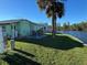 Backyard patio with seating area overlooking a canal at 35127 Danny Dr, Zephyrhills, FL 33541