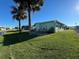 Backyard patio with seating area overlooking a canal at 35127 Danny Dr, Zephyrhills, FL 33541