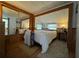 Bright bedroom with mirrored closet and wood flooring at 35127 Danny Dr, Zephyrhills, FL 33541