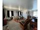 Spacious living room featuring a comfortable seating arrangement and carpeting at 35127 Danny Dr, Zephyrhills, FL 33541