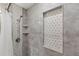 Shower with patterned tile and built-in shelves at 3637 63Rd N St, St Petersburg, FL 33710