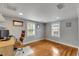 Hardwood floor bedroom with two windows and a desk at 37136 Belford Ct, Zephyrhills, FL 33541