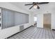 Sunroom with tiled floor, large window, and ceiling fan at 4925 Alcazar S Way, St Petersburg, FL 33712