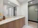 Modern bathroom with wood vanity and quartz countertop at 5120 Marina Way # 16002, Tampa, FL 33611