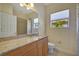 Clean bathroom, granite countertop, single vanity, and shower/tub combo at 5280 Echo Ln, Sarasota, FL 34233