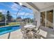 Relaxing screened pool area with patio table and chairs at 5280 Echo Ln, Sarasota, FL 34233