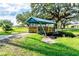 Blue footbridge over a small waterway in a park-like setting at 5307 Flint St, Zephyrhills, FL 33542