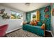 Cozy bedroom with daybed, patterned wallpaper and window at 6327 Hampton N Dr, St Petersburg, FL 33710