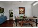 Rustic dining table with colorful chairs and bench in the dining area at 6327 Hampton N Dr, St Petersburg, FL 33710