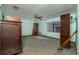 Bedroom with tiled floors, mold, and old furniture at 635 Hudson Ave, Tampa, FL 33606