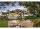 Attractive single-story home with a landscaped yard at dusk at 635 Hudson Ave, Tampa, FL 33606