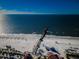 Aerial view of beach, pier, and ocean at 643 Blue Taverna Ln, Clearwater, FL 33756