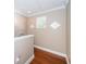 Bright hallway with wood floors and crown molding at 643 Blue Taverna Ln, Clearwater, FL 33756