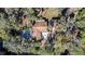 House with pool and detached structure, situated on a lush waterfront property at 7106 Riverwood Blvd, Tampa, FL 33615