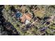 Aerial view showing a home, pool, and detached structure on a waterfront lot at 7106 Riverwood Blvd, Tampa, FL 33615