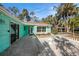 Quaint patio area with stonework and a white stone table at 7106 Riverwood Blvd, Tampa, FL 33615