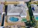 Aerial view showcasing home's layout and private pool at 8015 Idlebriar Ln, Port Richey, FL 34668