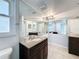 Bright bathroom boasts double sinks and a large mirror at 8015 Idlebriar Ln, Port Richey, FL 34668