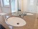 Modern bathroom sink with granite countertop and chrome faucet at 8015 Idlebriar Ln, Port Richey, FL 34668