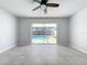 Bedroom with pool view and ceiling fan at 8015 Idlebriar Ln, Port Richey, FL 34668