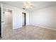 Bright bedroom with tile floors and a large closet at 8015 Idlebriar Ln, Port Richey, FL 34668